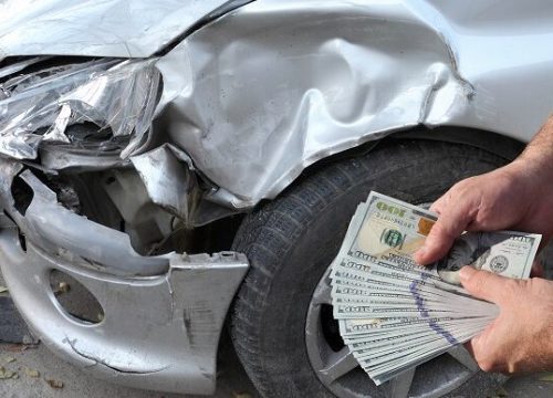 Damaged car inspection, male hands holding money, dollar banknotes, insurance agent or worker, mechanic